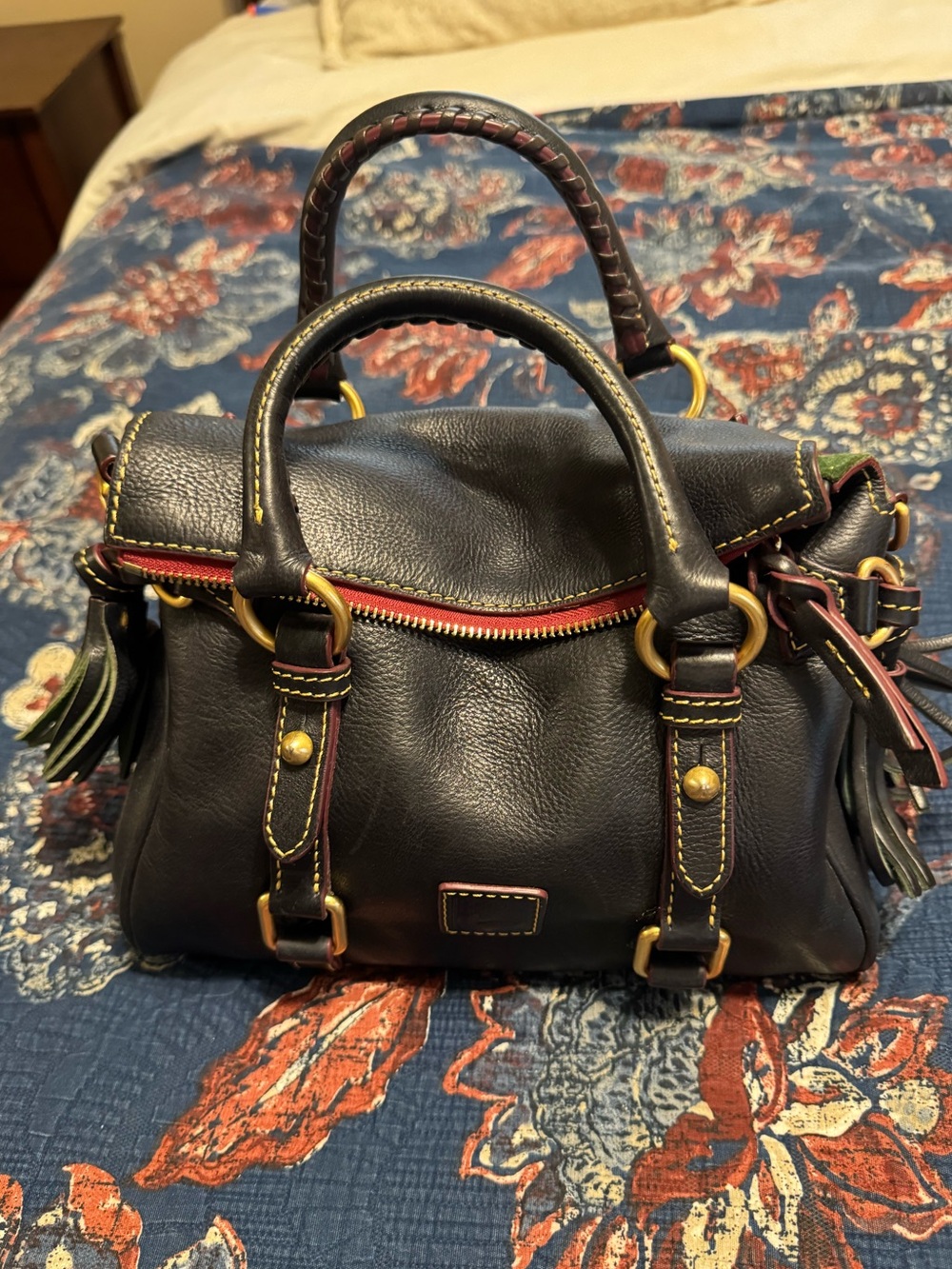 Dooney & Bourke Black Leather Satchel with Brass Hardware and Red Trim